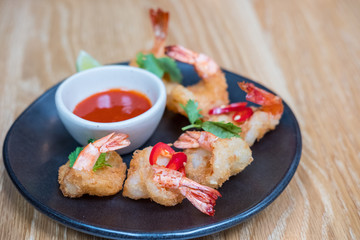 Fried shrimp on plate with sauce for served in a restaurant