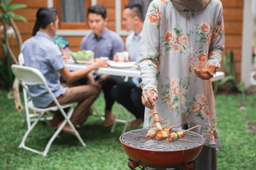 asian people barbecue with friends