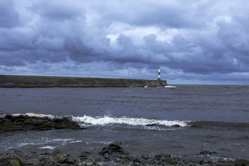 Stone jetty with beacon in Aberystwyth Ceredigion Wales UK