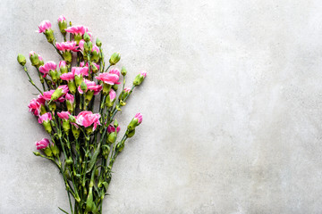 Fresh spring flowers bouquet on grey background, flat lay, overhead