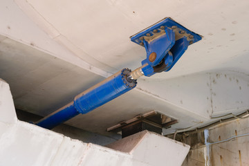 under bridge massive Hydraulic damper used to dissipate the large amounts of energy that result...