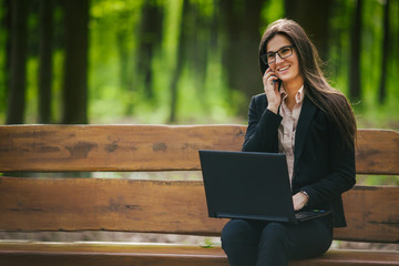 pretty girl smiling while communicating on the phone