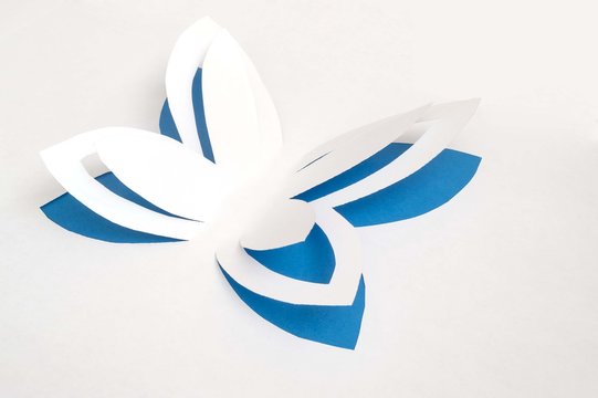 blue paper butterfly flapping its wings