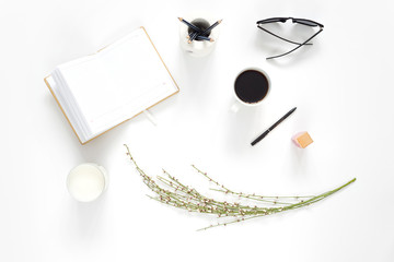 Fatlay with stationary, glasses and coffee on white background