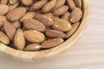macro of a bowl full of almonds