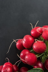 Black background with red radish