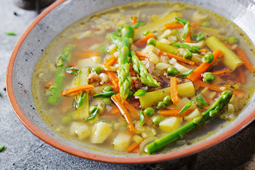 Soup with beef, asparagus, green peas, carrots and celery. Dietary menu. Healthy food.