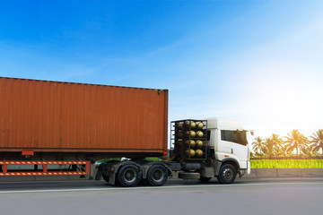 Fototapeta na wymiar Truck on highway road with red container, transportation concept.,import,export logistic industrial Transporting Land transport on the asphalt expressway with blue sky