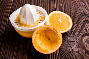 oranges and juice on a wooden background