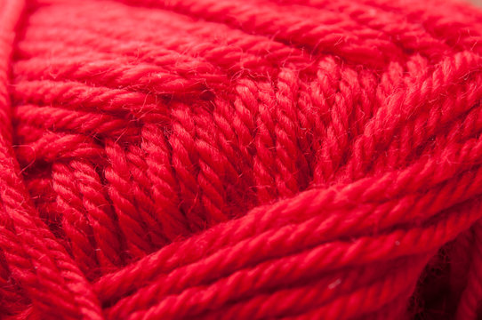 Closeup Of Ball Of Red Wool Yarn Texture