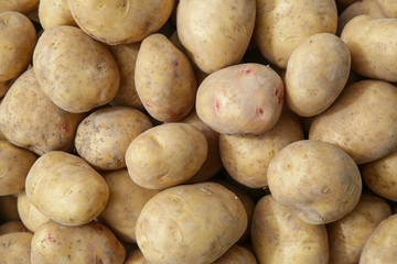 Crate of fresh potatoes on farmers market