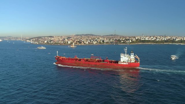 Ships floating Bosphorus blue water sunny day. Aerial drone view on sunset in Istanbul, Turkey