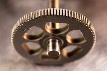 Metal teeth of a cogged wheel
