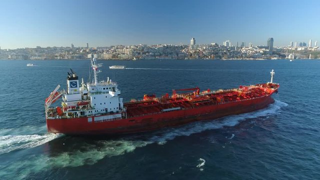 Ships floating Bosphorus blue water sunny day. Aerial drone view on sunset in Istanbul, Turkey