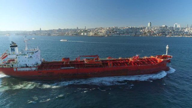 Ships floating Bosphorus blue water sunny day. Aerial drone view on sunset in Istanbul, Turkey