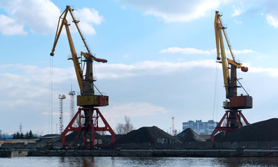 Seaport on the Baltic sea. Сommercial port. Port cranes and machinery.