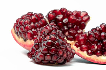 Fruits of Red Ripe Pomegranate on the White Background.