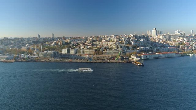 Ships floating Bosphorus blue water sunny day. Aerial drone view on sunset in Istanbul, Turkey