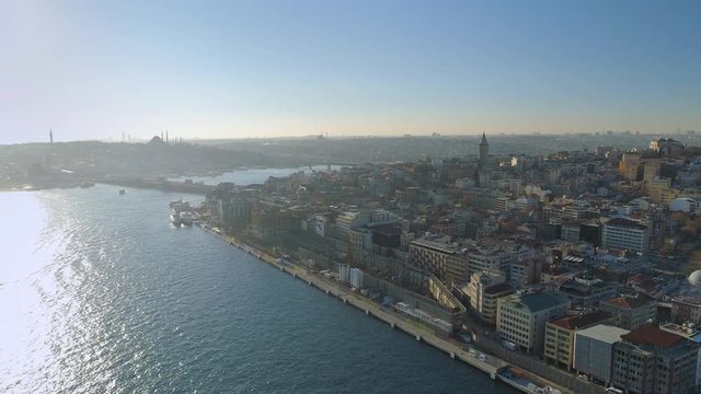 Ships floating Bosphorus blue water sunny day. Aerial drone view on sunset in Istanbul, Turkey