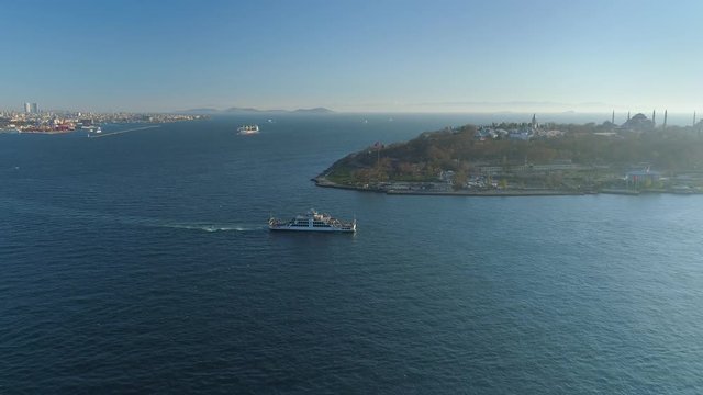 Ships floating Bosphorus blue water sunny day. Aerial drone view on sunset in Istanbul, Turkey