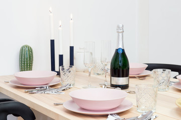 Laid table with bottle of sekt