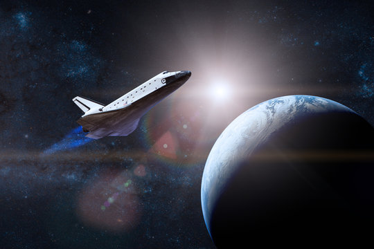Blue planet Earth. Space shuttle taking off on a mission. Elements of this image furnished by NASA.