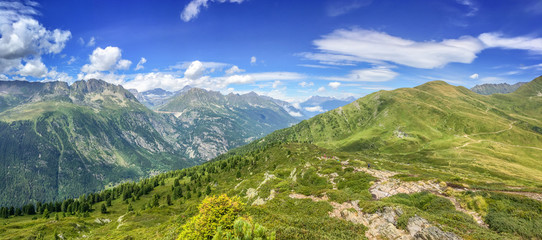 Panorama of the Alps in summer. View on the Emosson dam in Switzerland during Tour du Mont Blanc hike