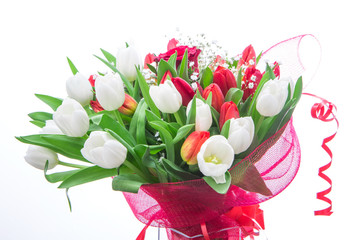 beautiful bouquet of red and white tulip and one rose