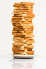 Tower of toasted bread against a white background