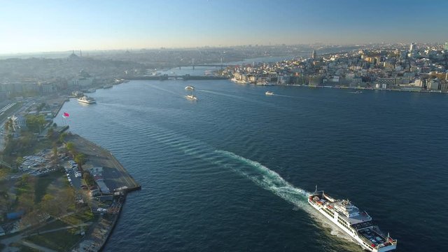 Ships floating Bosphorus blue water sunny day. Aerial drone view on sunset in Istanbul, Turkey