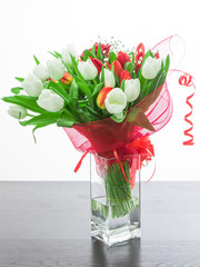 beautiful bouquet of red and white tulip and one rose
