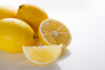 Lemon and juice on a white background