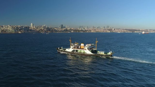Ships floating Bosphorus blue water sunny day. Aerial drone view on sunset in Istanbul, Turkey