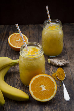 Orange banana smoothie with ginger and curcuma