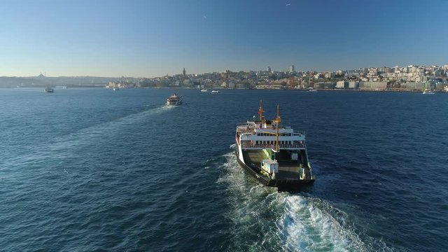 Ships floating Bosphorus blue water sunny day. Aerial drone view on sunset in Istanbul, Turkey