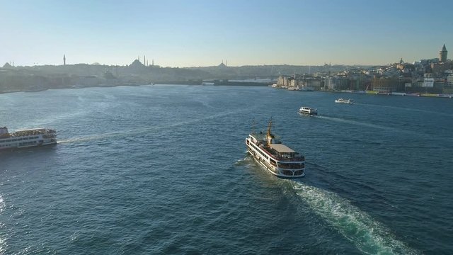 Ships floating Bosphorus blue water sunny day. Aerial drone view on sunset in Istanbul, Turkey