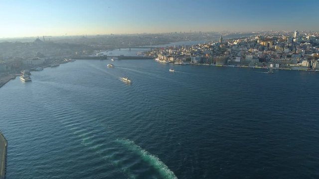 Ships floating Bosphorus blue water sunny day. Aerial drone view on sunset in Istanbul, Turkey