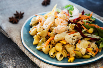 Pasta with vegetables and Shrimps lemon cream basil