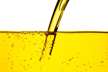 Oil car motor or vegetable oil pouring with bubble isolated on white background