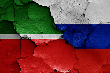 flags of Tatarstan and Russia painted on cracked wall