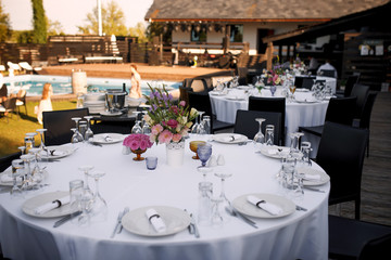 Formal dinner service at a outdoor wedding banquet