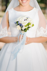 Bride with a white hydrangea wedding bouquet
