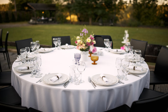 Formal dinner service at a outdoor wedding banquet