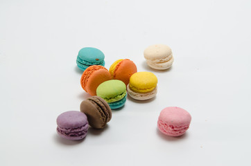 Many colorful macaroon on white background. depth of field