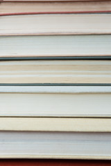 Stack books on wooden background. Back to school with copy space.