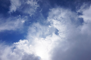 Obraz premium texture of the sky with large clouds and sun rays