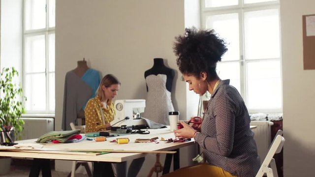 Young creative women in a studio, startup business.