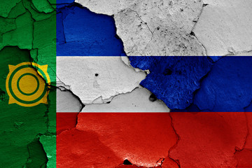 flags of Khakassia and Russia painted on cracked wall