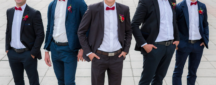 Groom and his friends pose in a restaurant