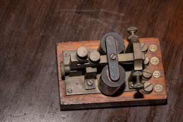 The old telegraph on wooden table